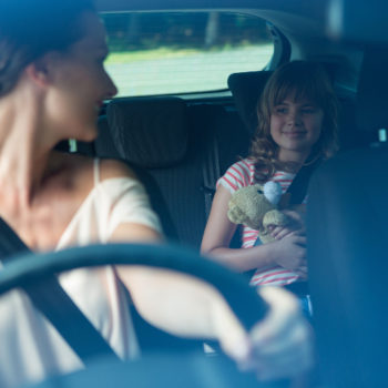 Intoxicated woman driving with a child in the vehicle.