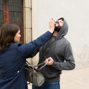 Angry woman defending herself from a thief