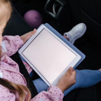 little girl using digital tablet